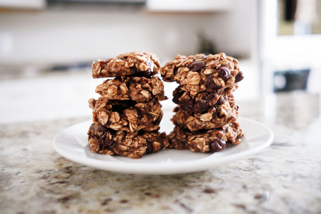 Close-up of homemade chocolate oatmeal no-bake cookies on saucer.